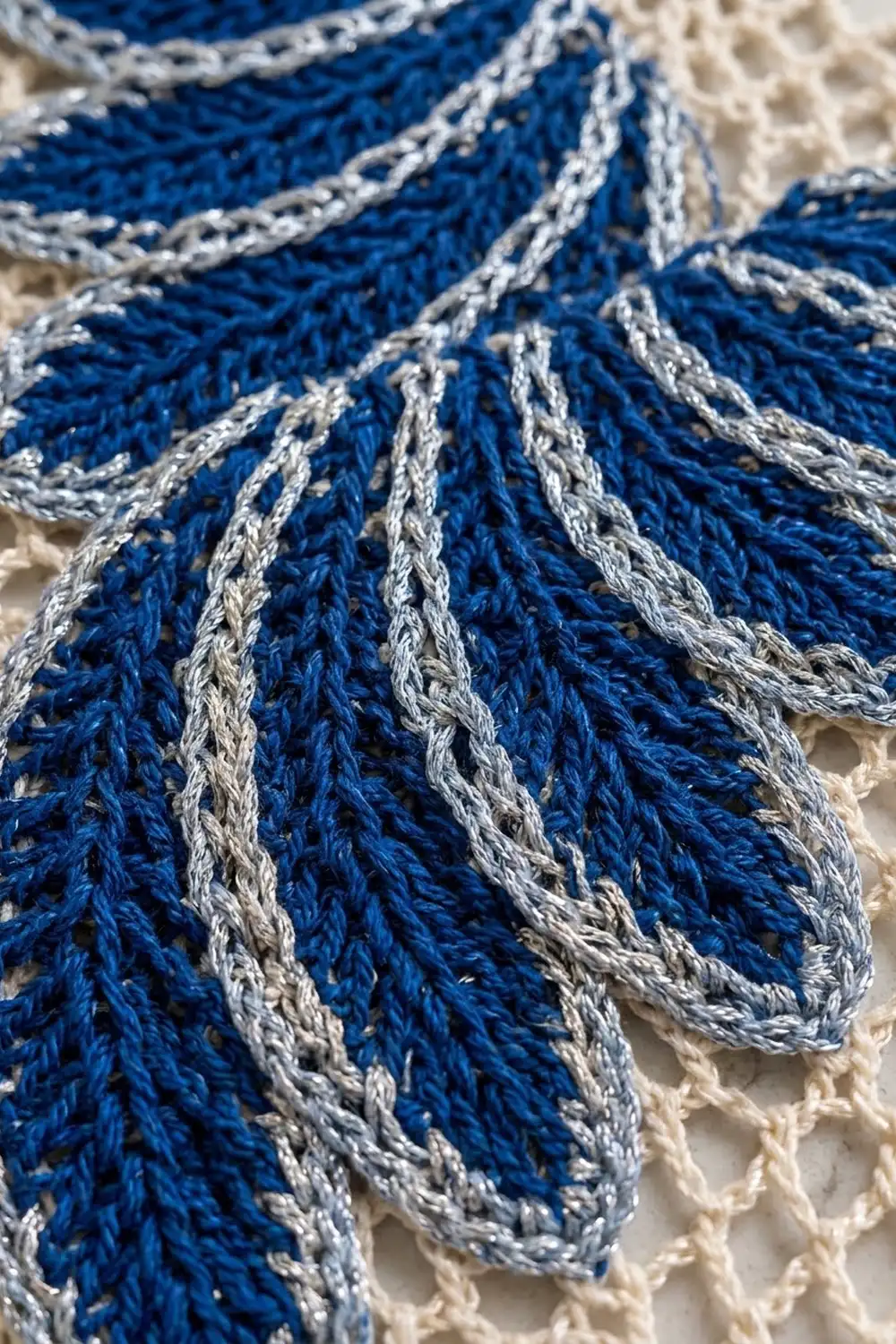 Close-up of braided blue and white nautical rope with detailed texture and knot work.