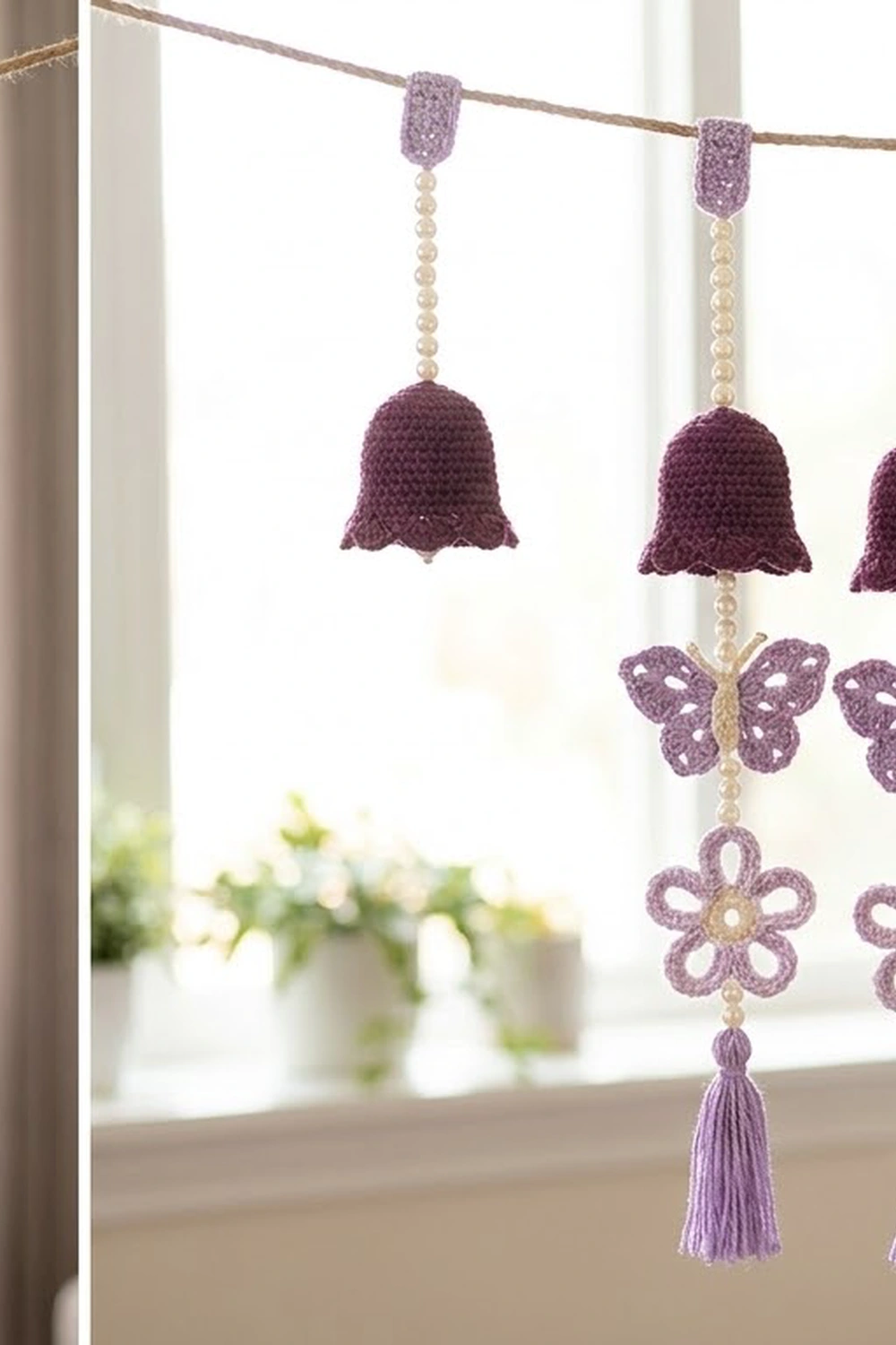 Mauve crocheted bell charms with pearl beads, butterfly and flower accents dangle in a soft window setting.