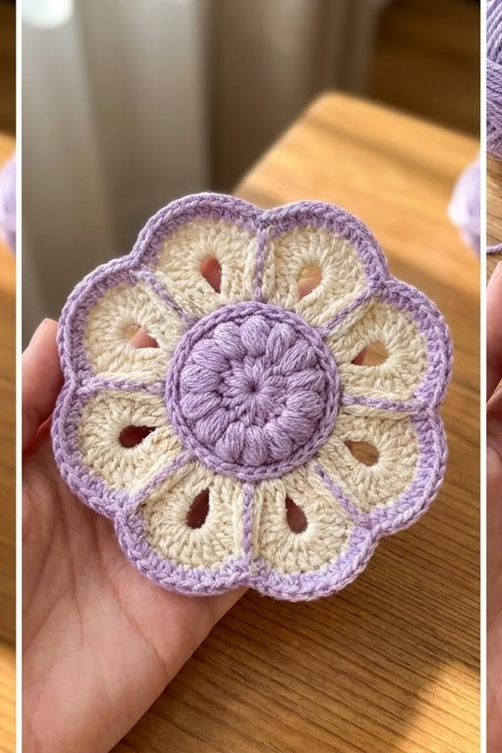 Lavender and cream crocheted flower with bobbled center held in hand over a wooden table.