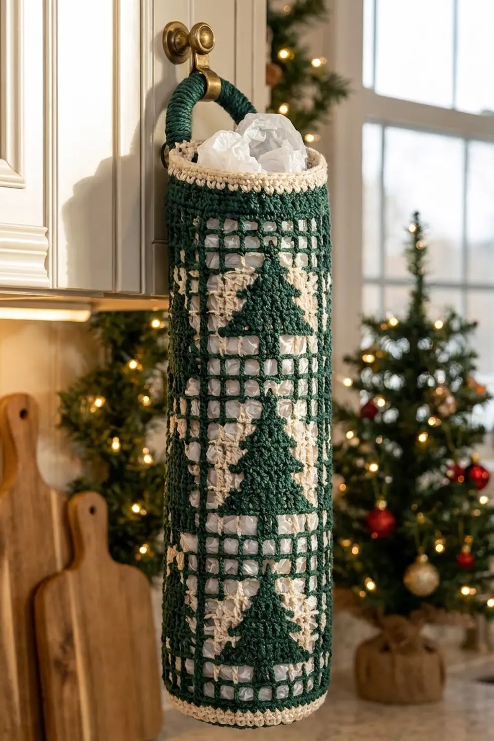 Green and cream crocheted basket with rope handle hangs on a brass doorknob holding white tissues, surrounded by holiday decorations.